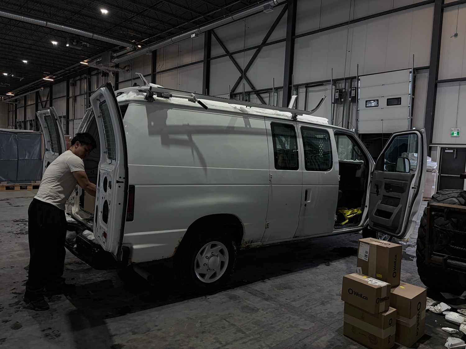 Intact Courier driver loading time-sensitive medical deliveries before dawn