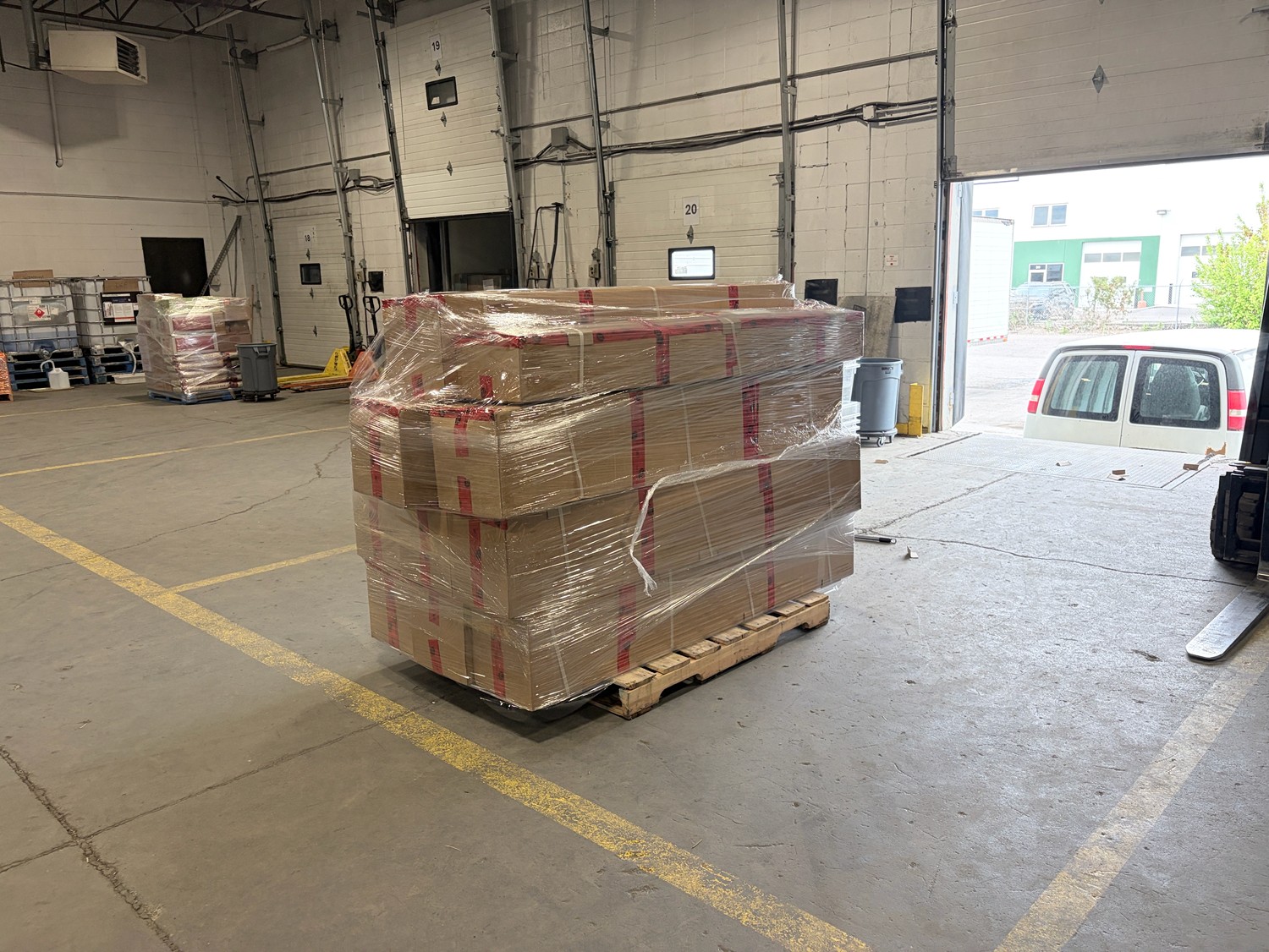 Palletized freight staged on the dock for overnight mid-mile linehaul between cities